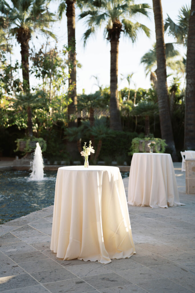 Royal Palms wedding cocktail hour high boys with bud vases.