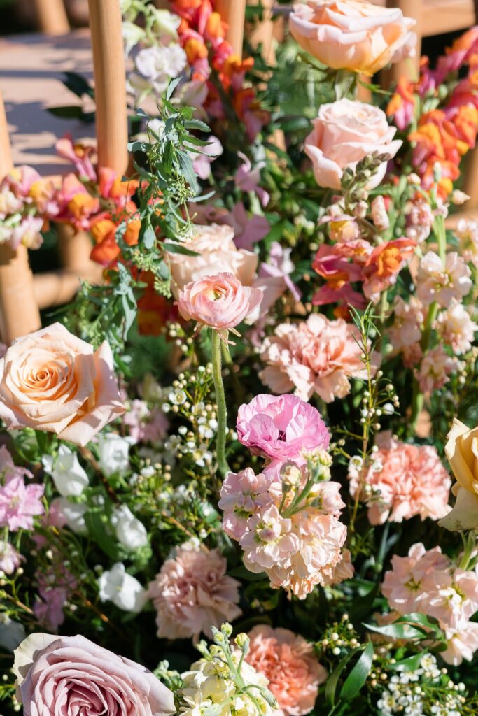 Wedding flowers in pink, peach, and white colors.