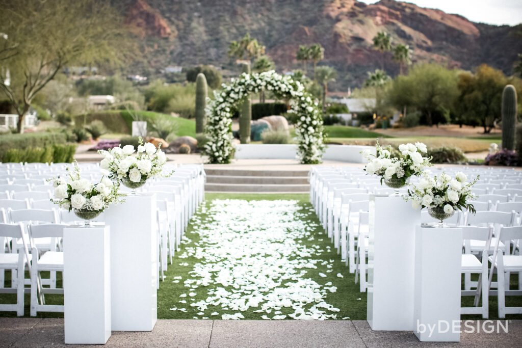 Wedding ceremony space with white floral design.