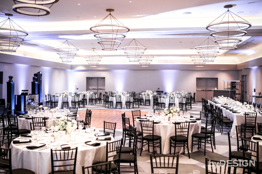 Staged indoor wedding reception with white flowers centerpieces at Mountain Shadows.