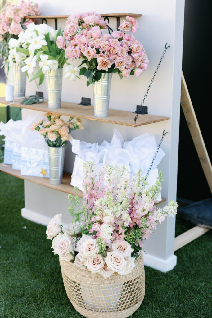 Flowers on shelves and in containers for guests to make their own bouquets.
