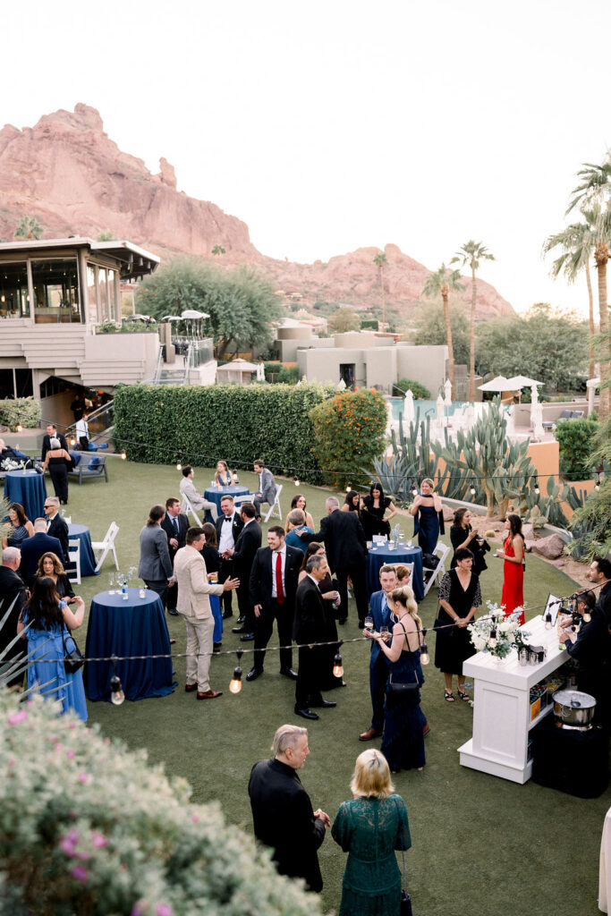 Outdoor wedding reception with guests at Sanctuary Resort.