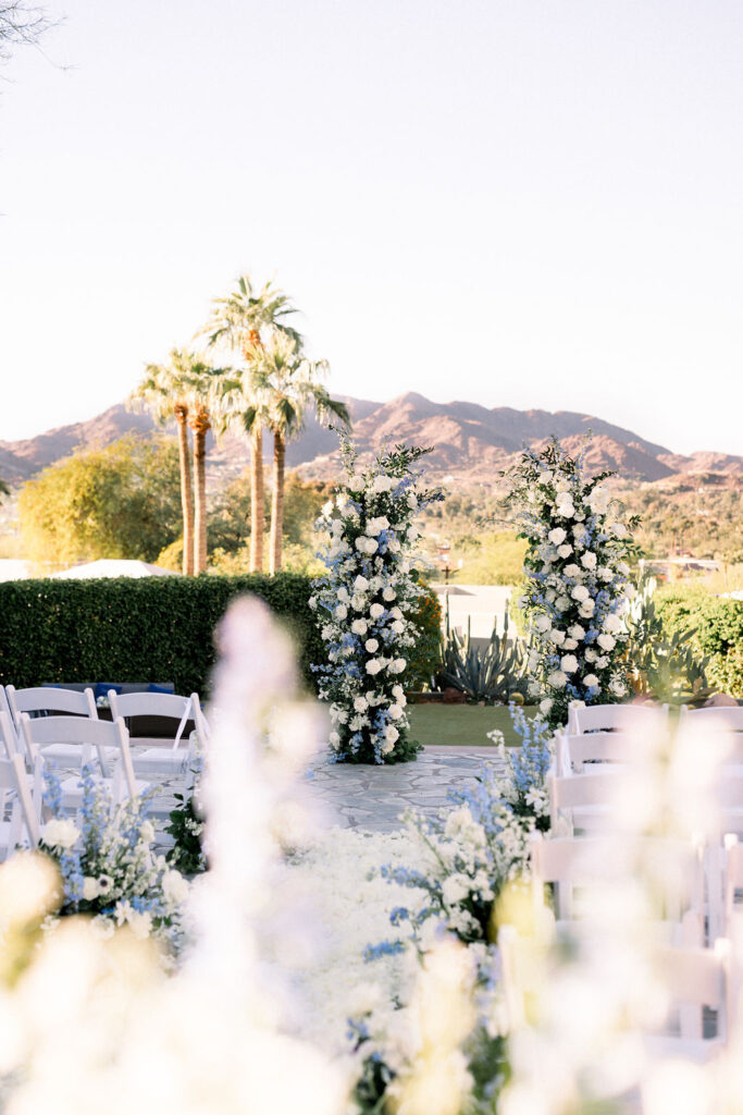 Sanctuary Resort outdoor wedding ceremony with desert mountains and landscape in background.
