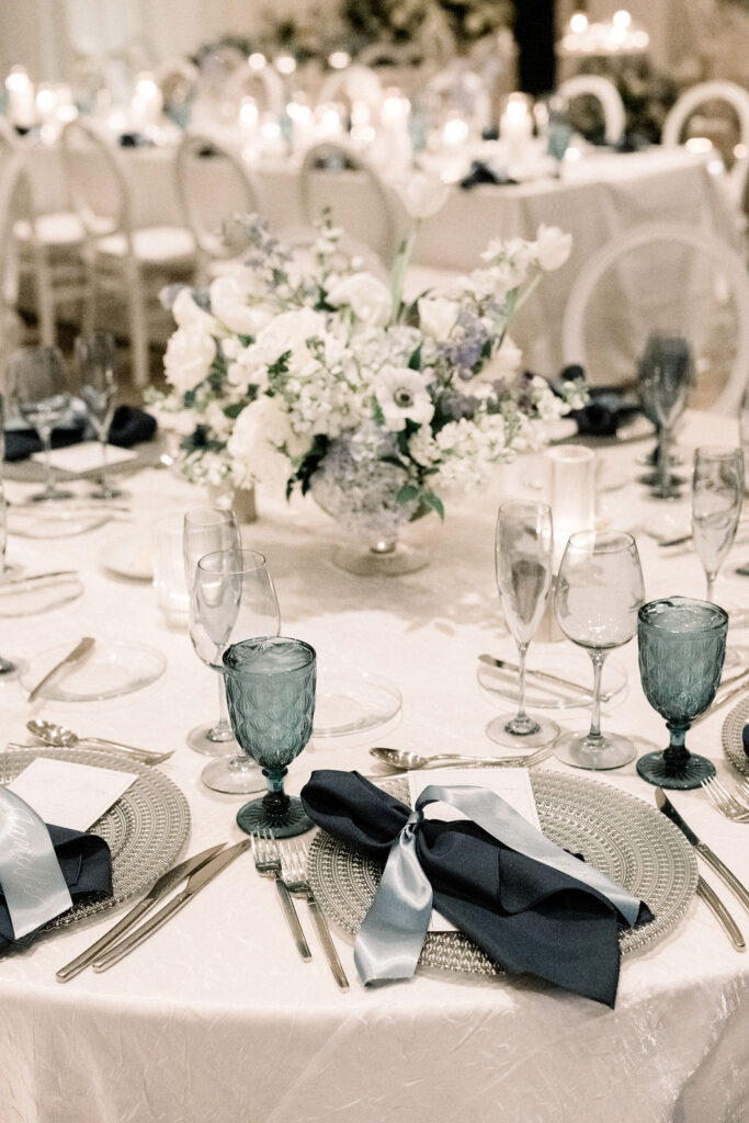 White and blue flowers wedding reception centerpiece.