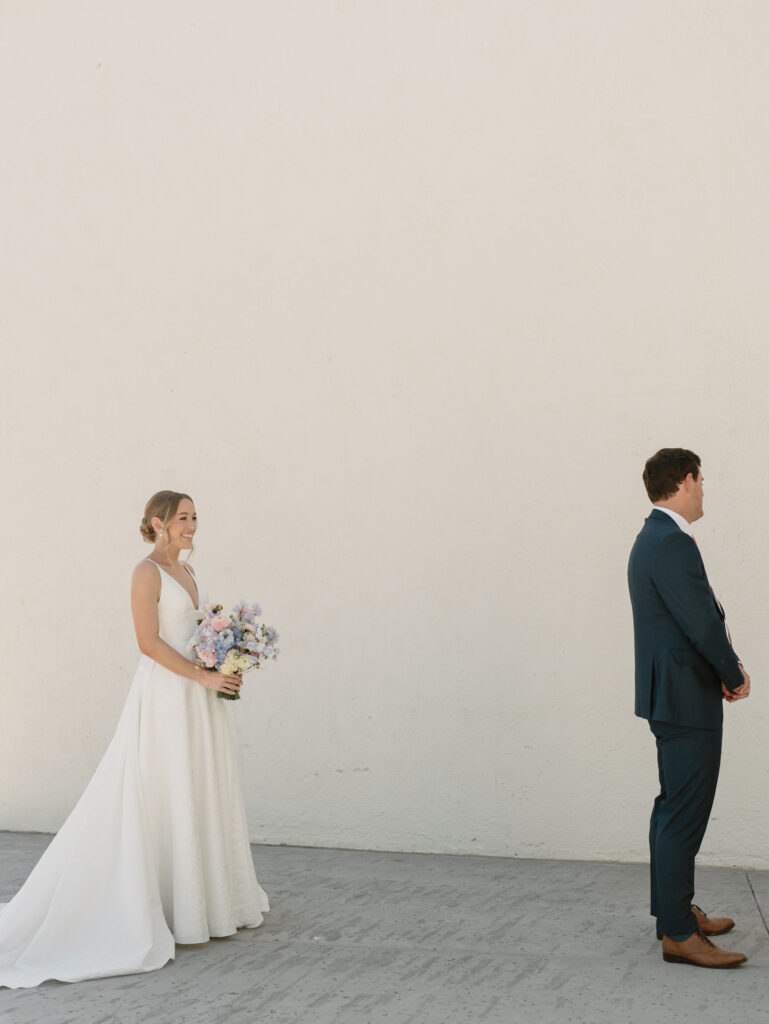 First look for bride and groom before groom has turned around.