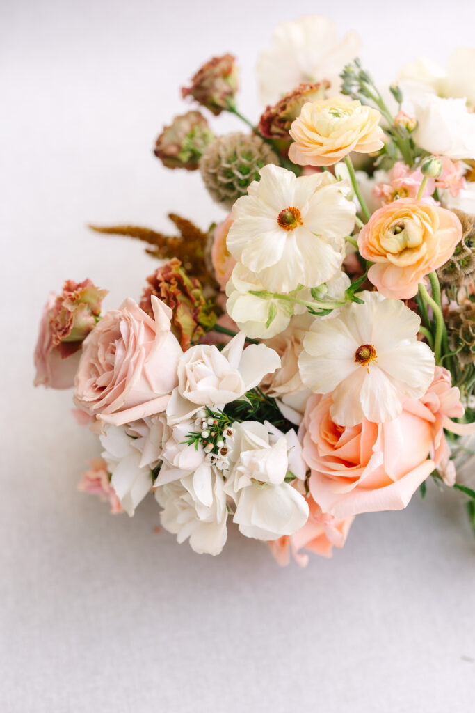 Wedding bridal bouquet of sunset colors flowers.