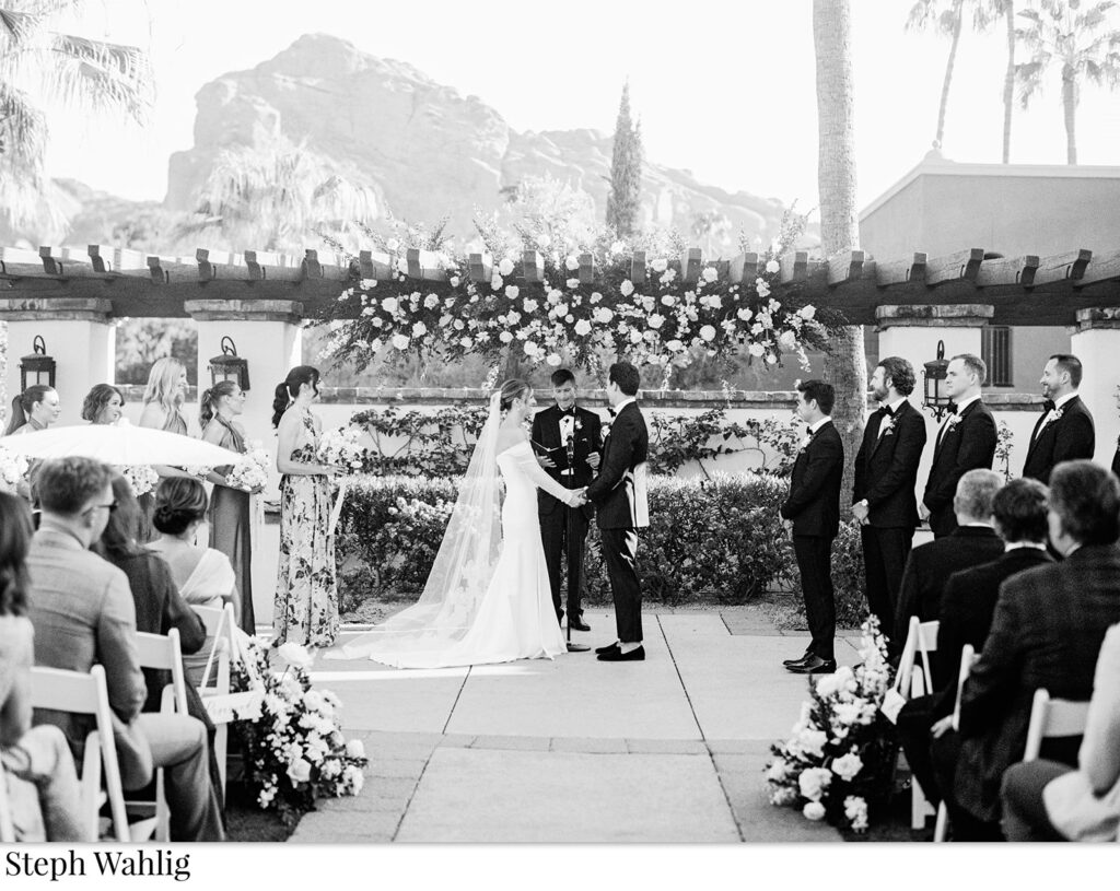 Bride and groom in wedding ceremony altar space at Omni Resort during ceremony.