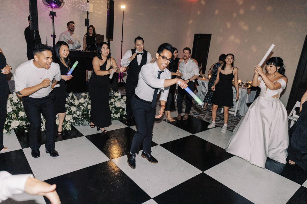 Wedding reception dance floor with guests.